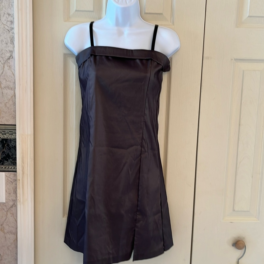 Black iridescent juniors dress. Knee length. SZ medium. Adjustable straps.
